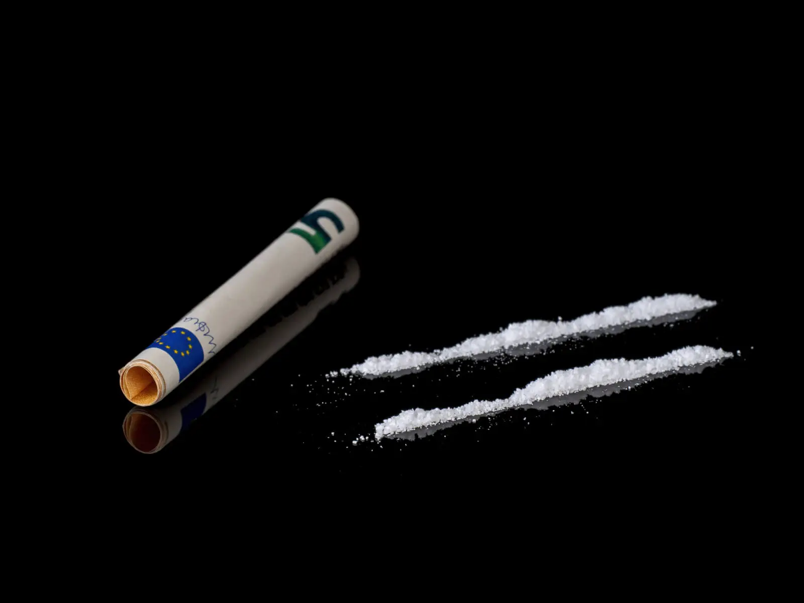 snorting cocaine: Cocaine causes the brain to release dopamine, serotonin, and norepinephrine.